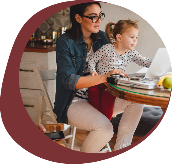 A woman and child cooking together in a kitchen.